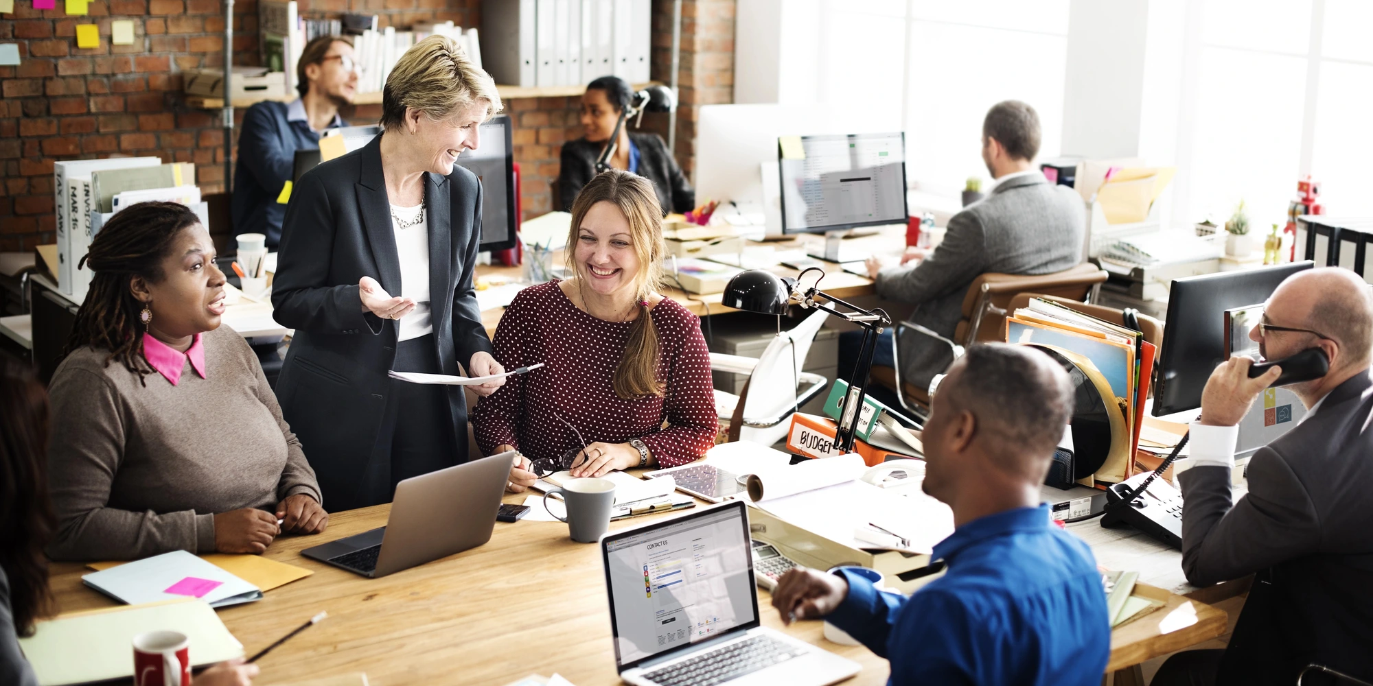 people gathered in the office after workplace harassment training